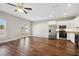 Spacious living area with hardwood floors, stainless steel appliances, and natural light from large windows at 310 N 1St Ave, Bartow, FL 33830