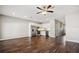 Open living area with hardwood floors, stainless steel appliances, and recessed lighting at 310 N 1St Ave, Bartow, FL 33830