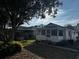 Charming single-story home with a screened front porch and beautiful landscaping at 3265 Conine, Winter Haven, FL 33881