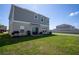 View of the backyard featuring a patio with outdoor seating and green lawn at 3440 Dahlia Dr, Haines City, FL 33844