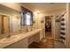 Spacious bathroom with double vanity, ample counter space, and access to a well-organized walk-in closet at 3440 Dahlia Dr, Haines City, FL 33844
