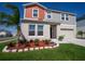 Image of a house with a well-maintained front yard and two-car garage at 3440 Dahlia Dr, Haines City, FL 33844