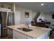 Kitchen with stainless steel appliances, island sink, and open view to the dining area at 3440 Dahlia Dr, Haines City, FL 33844
