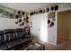 Comfortable living room featuring a leather sofa, sports memorabilia, and a cozy atmosphere for relaxation at 3440 Dahlia Dr, Haines City, FL 33844