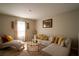 Stylish living room featuring a comfortable sofa, decorative pillows, and a chic coffee table at 3440 Dahlia Dr, Haines City, FL 33844