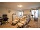 Cozy main bedroom with plush bedding, decorative pillows, and a sitting area for relaxation and comfort at 3440 Dahlia Dr, Haines City, FL 33844