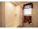 Bathtub with a shower featuring white tile, shower curtain, and natural light at 3440 Dahlia Dr, Haines City, FL 33844