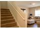 Carpeted staircase leading to the second floor, adjacent to the living area at 3440 Dahlia Dr, Haines City, FL 33844