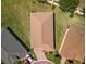 Overhead view of the home showing roof, driveway, landscaping, and neighboring properties at 3565 Raleigh Dr, Winter Haven, FL 33884