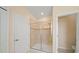 Bathroom with tile shower, glass enclosure, and a tiled shower floor at 3565 Raleigh Dr, Winter Haven, FL 33884