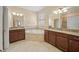 Bathroom with a double vanity, granite countertop, and a large soaking tub at 3565 Raleigh Dr, Winter Haven, FL 33884