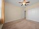 Bedroom featuring carpet flooring, a window, and a closet with mirrored doors at 3565 Raleigh Dr, Winter Haven, FL 33884