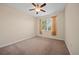 Bedroom with carpet flooring, standard windows, and a ceiling fan at 3565 Raleigh Dr, Winter Haven, FL 33884