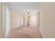 A spacious bedroom includes neutral paint and carpeting, a ceiling fan, and a window at 3565 Raleigh Dr, Winter Haven, FL 33884