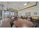 Large and well-lit clubhouse with tables and chairs, perfect for social gatherings at 3565 Raleigh Dr, Winter Haven, FL 33884
