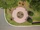 Overhead view of community green space with benches and decorative landscaping at 3565 Raleigh Dr, Winter Haven, FL 33884