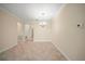 Dining area featuring tile flooring, chandelier, neutral paint, and an open layout at 3565 Raleigh Dr, Winter Haven, FL 33884