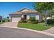 Charming single-story home with a well-manicured lawn and a brick driveway at 3565 Raleigh Dr, Winter Haven, FL 33884