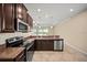 A modern kitchen with granite countertops, stainless steel appliances, and ample cabinet space at 3565 Raleigh Dr, Winter Haven, FL 33884