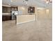 Open living area with a kitchen featuring dark wood cabinets, stainless appliances, and a breakfast bar at 3565 Raleigh Dr, Winter Haven, FL 33884