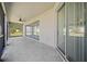 Spacious covered patio featuring ceiling fan and sliding glass doors to extend the living space at 3565 Raleigh Dr, Winter Haven, FL 33884