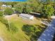 This home offers ample land with large green spaces perfect for outdoor activities and a cozy front deck at 3611 Island Oaks Ct, Lakeland, FL 33805