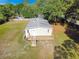 Aerial shot of a cozy house featuring a deck and a well-manicured lawn at 3611 Island Oaks Ct, Lakeland, FL 33805