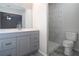 Bathroom featuring a new vanity with marble counter and a tiled shower at 3611 Island Oaks Ct, Lakeland, FL 33805