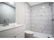 Updated bathroom with modern vanity, lighting and stylish tile and fixtures at 3611 Island Oaks Ct, Lakeland, FL 33805