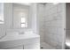Clean bathroom showcasing vanity, mirror, stylish tile and walk in shower at 3611 Island Oaks Ct, Lakeland, FL 33805