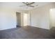 Bright bedroom with ceiling fan and neutral carpeting creating a blank canvas at 3611 Island Oaks Ct, Lakeland, FL 33805