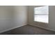 Cozy room with carpet, a window and light-colored walls at 3611 Island Oaks Ct, Lakeland, FL 33805