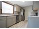 Modern kitchen with stainless steel appliances, sleek countertops, and ample cabinet space at 3611 Island Oaks Ct, Lakeland, FL 33805
