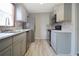 This newly remodeled kitchen boasts stainless steel appliances, stone backsplash, and durable floors at 3611 Island Oaks Ct, Lakeland, FL 33805