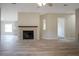 Cozy living room featuring a brick fireplace and stylish floors, creating a warm and inviting atmosphere at 3611 Island Oaks Ct, Lakeland, FL 33805