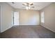 Spacious main bedroom with neutral paint, carpet and a ceiling fan at 3611 Island Oaks Ct, Lakeland, FL 33805