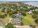 Luxurious waterfront property with a private pool, lush greenery, and direct access to the lake, offering a serene retreat at 3826 Gaines Ct, Winter Haven, FL 33884
