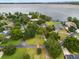 Picturesque lakefront community with beautiful homes, mature trees, and private docks offering serene and luxurious living at 3826 Gaines Ct, Winter Haven, FL 33884