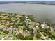 Beautiful neighborhood with lake access, mature trees and well-maintained landscaping, offering a blend of nature and luxury living at 3826 Gaines Ct, Winter Haven, FL 33884