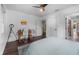 Bright bedroom with a ceiling fan, natural light, and a wooden desk for a functional space at 3826 Gaines Ct, Winter Haven, FL 33884