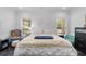 Bedroom with tiled floor, large windows, ceiling fan, and comfortable decor at 3826 Gaines Ct, Winter Haven, FL 33884