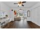 Bright bedroom featuring wood floors, natural light, and a partial view of the bed at 3826 Gaines Ct, Winter Haven, FL 33884