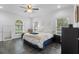 Bright bedroom with tiled floor, large windows, ceiling fan, and comfortable decor at 3826 Gaines Ct, Winter Haven, FL 33884