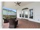 Inviting covered patio with comfortable seating and view to yard at 3826 Gaines Ct, Winter Haven, FL 33884