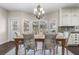 Bright dining room with backyard views and classic chandelier lighting at 3826 Gaines Ct, Winter Haven, FL 33884