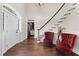 Elegant foyer boasting hardwood floors, a grand staircase, and tasteful decor that creates a welcoming entrance at 3826 Gaines Ct, Winter Haven, FL 33884