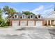 Spacious four car garage with ample parking space on an expansive lot at 3826 Gaines Ct, Winter Haven, FL 33884