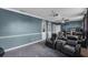 This home theater boasts a large screen, comfortable leather seating, and stylish decor for the perfect movie night at 3826 Gaines Ct, Winter Haven, FL 33884