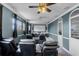 Home theater with comfortable seating, projector, and immersive sound system at 3826 Gaines Ct, Winter Haven, FL 33884