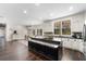 Open kitchen features a large island, modern appliances, and hardwood flooring at 3826 Gaines Ct, Winter Haven, FL 33884